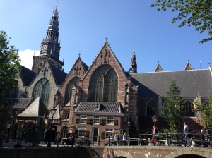 The striking facade of de Oude Kerk today. It dominates the skyline of the area (directly across the canal from the church is the boundary of the Red Light District)